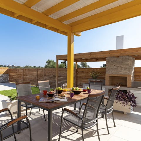 Enjoy family meals alfresco around the outside dining table