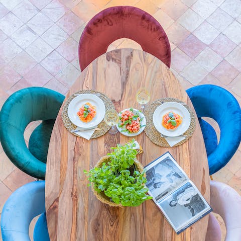 Gather the group around the beautiful wooden dining table