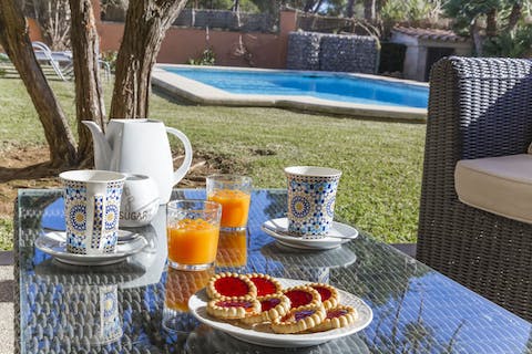 Start the day with fresh orange juice and pastries by the pool