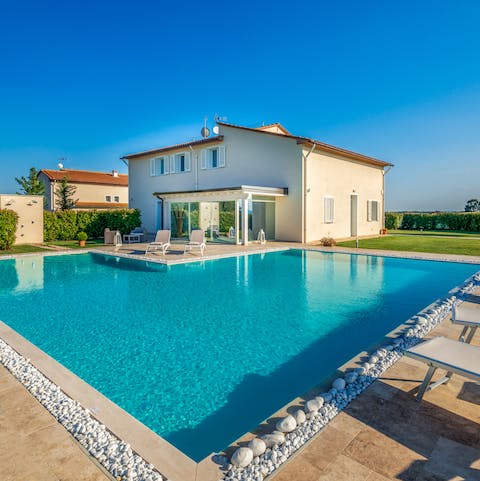 Spend blissful days lounging by the pool, soaking in the Tuscan countryside, and going for swims to cool off