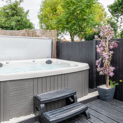 Relax in the soothing bubbles of the hot tub