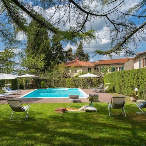 Cool off in the shared pool after a day of Tuscan sightseeing