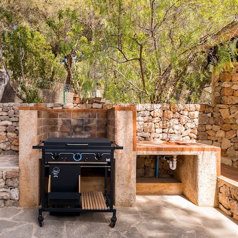 Grill up a feast in the outdoor kitchen