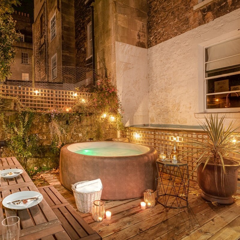 Turn the fairy lights on and take an evening dip in the home's hot tub