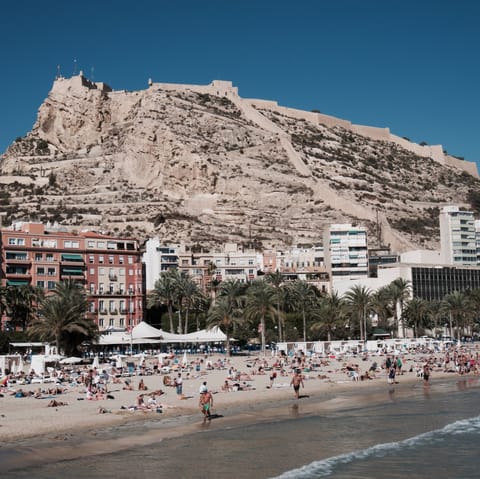 Drive down to the golden shores of Moraira's Playa de l'Ampolla