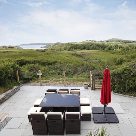 Sip your morning coffee looking out over Three Cliffs Bay