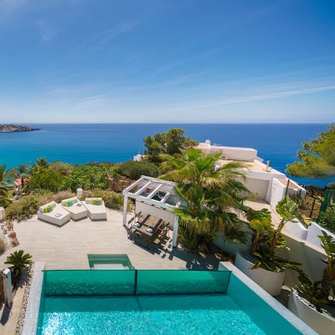 Admire the ocean views from your infinity pool