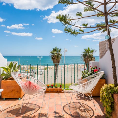 Watch the Mediterranean glisten in the distance from the master bedroom's balcony