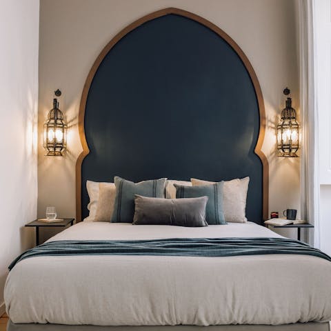 Get some rest in the comfy bed with its decadent Moroccan inspired headboard