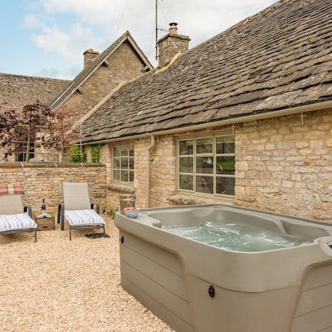 Get comfy on the sun loungers and unwind in the hot tub