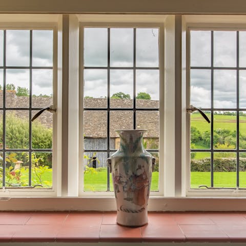 Admire views across farmland from your Grade II listed cottage