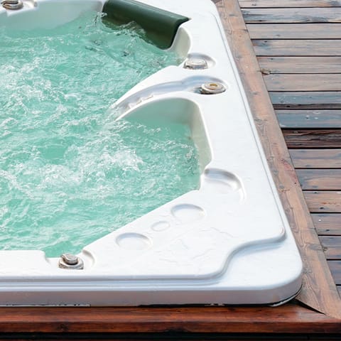 Relax and unwind in the communal hot tub 