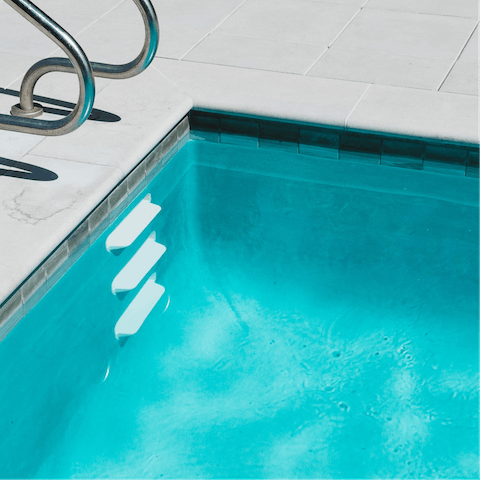 Take a dip in the heated swimming pool 