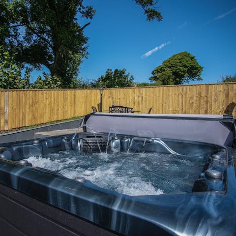 Soak up the sights and sounds of the Welsh countryside from the private hot tub