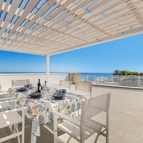 Dine alfresco with loved ones as you drink in the sea views