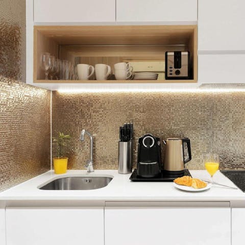 Whip up a quick meal in style in the shimmering gold kitchenette