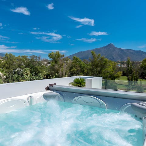 Sink into the Jacuzzi tub and admire the views from the rooftop