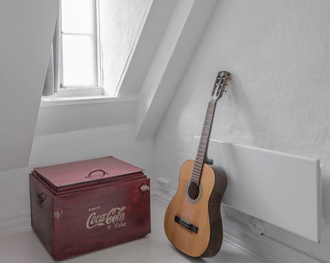 The retro Coca-Cola cooling box and guitar