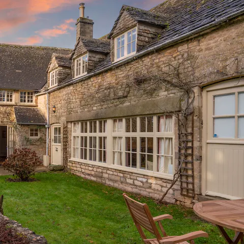 Watch the sky turn pink from the peaceful front garden, complete with seating