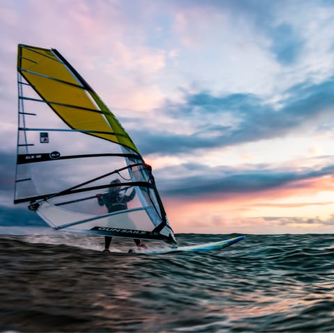 Get adventurous with a day of windsurfing