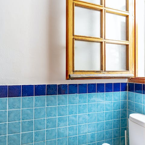 The turquoise bathroom tiles