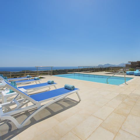 Enjoy sweeping views across the coast whilst lounging by the pool