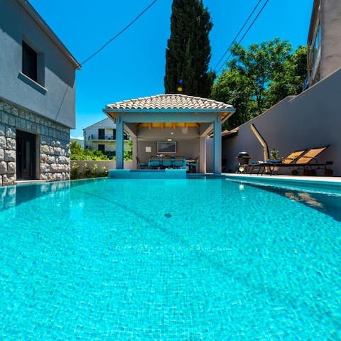 Slip into the turquoise pool for some respite from the heat of the day