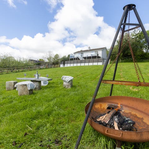 Start up the firepit and relax in the large garden