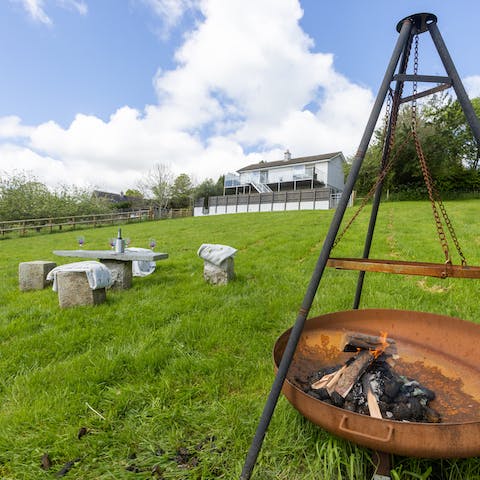 Start up the firepit and relax in the large garden