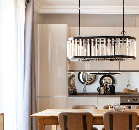 Admire the art deco lamp and dine under its soft glow