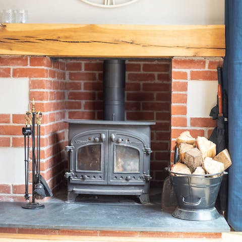 Snuggle up by the wood-burner on cooler evenings, a glass of wine in hand