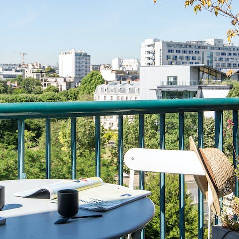 Sit outside on the balcony and gaze out over the Parisian skyline