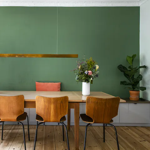The forest green accent wall