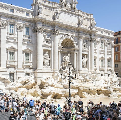 Walk just across the street to the landmark Trevi Fountain, visible from your window