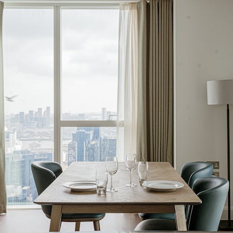 Dine in the sky thanks to the home's floor-to-ceiling windows 