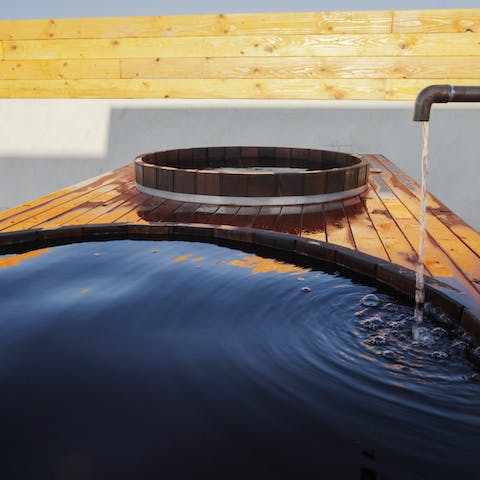 Start with a plunge in the cedar hot tub, followed by a dip in the cold tub