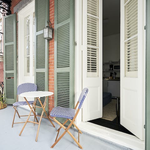 Enjoy your morning coffee on the balcony in front of the shutters