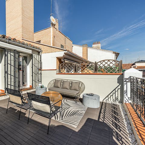 Soak up the Spanish sun on the rooftop terrace, with a glass of wine in hand