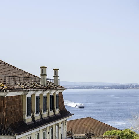 Peer out at the stunning River Tagus from your fourth-floor apartment