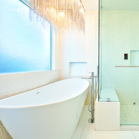Soak the day away in the free standing luxurious bath tub 