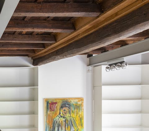 Admire the exposed beams made of ancient wood