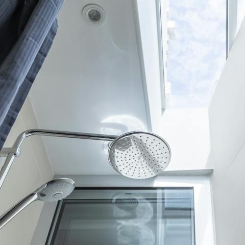 Relax under the skylight and decadent rainfall shower