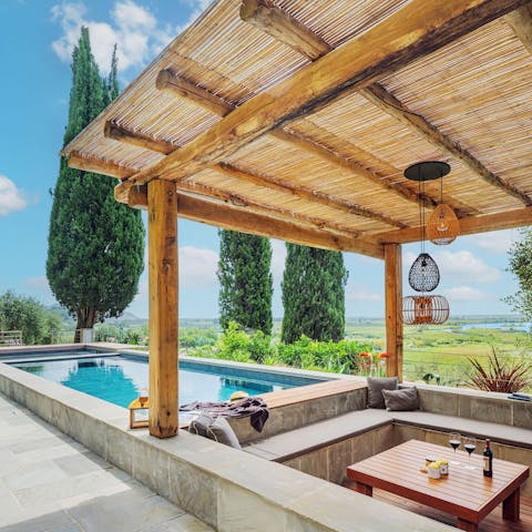 Laze by the pool and admire the view of Lake Massaciuccoli 