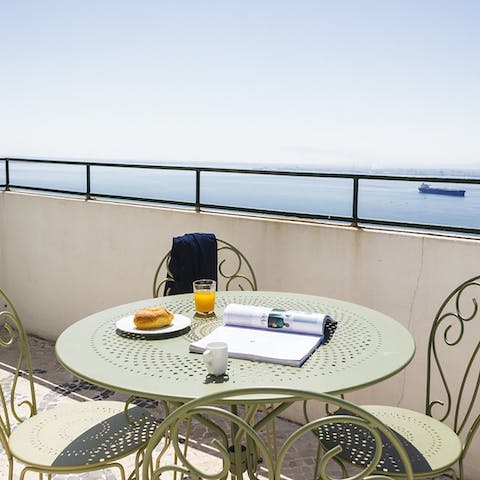 Enjoy breakfast on the terrace overlooking the water