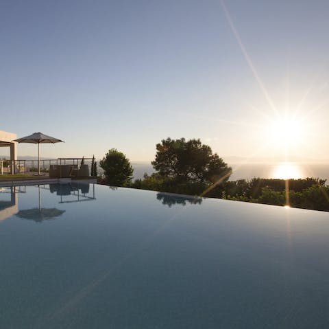 Watch the sunrise from the infinity pool