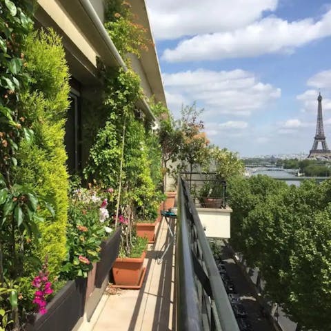 Admire Eiffel Tower views from the flowered balcony