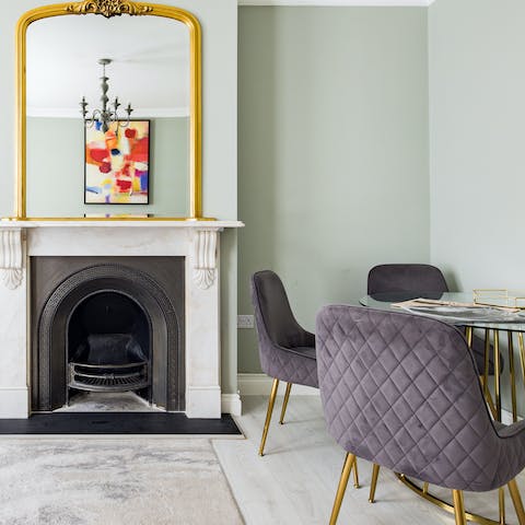 Enjoy a fireside meal at the stylish dining table