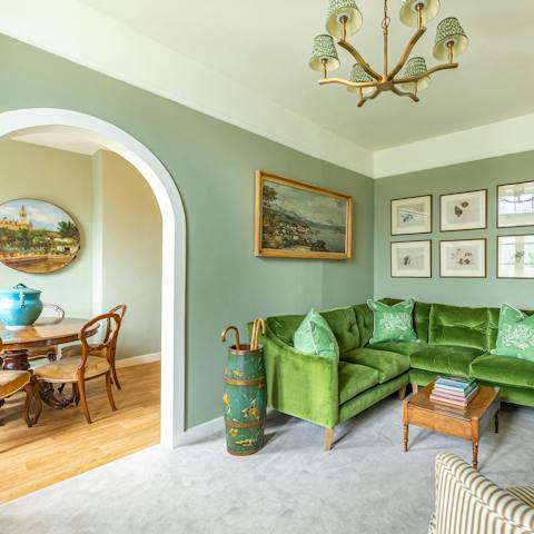 Relax and unwind in the soothing green living room