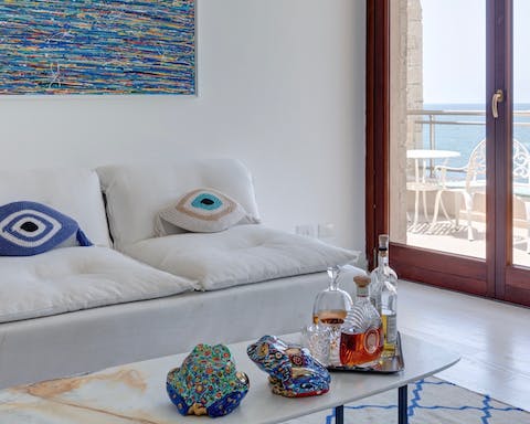 Hang out in the breezy living space and admire your host's colourful trinkets