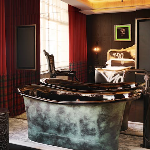 Relax and unwind in the luxurious freestanding bathtub 